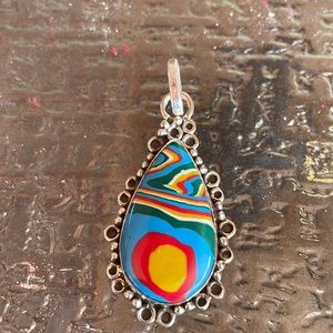 Calsilica genuine stone pendant. All sterling silver. Nice with jeans etc..